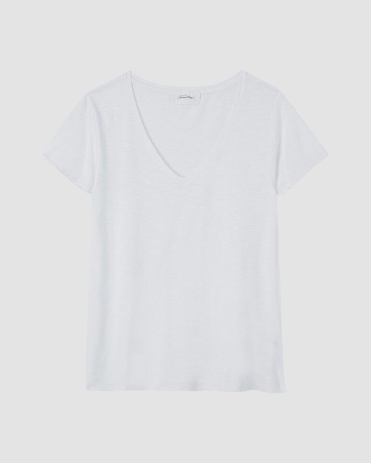 Plain white t-shirt on a light gray background