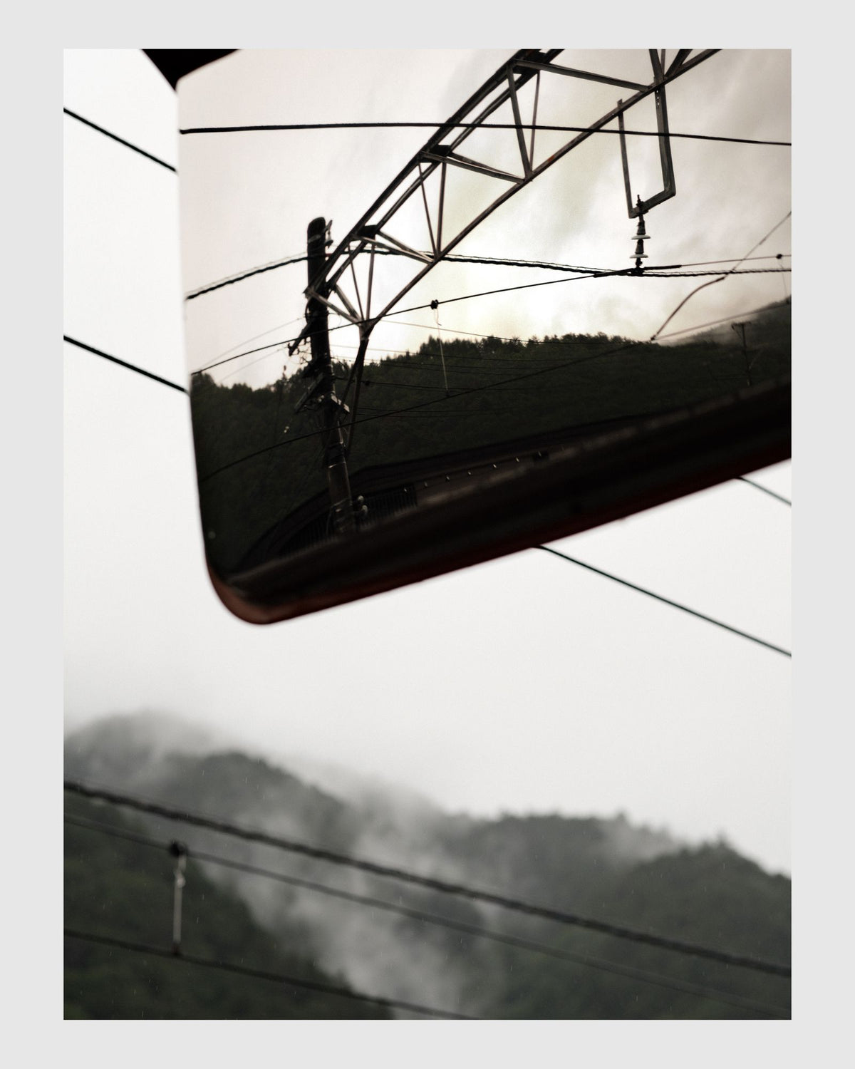 photo of power lines and a mountain range japan