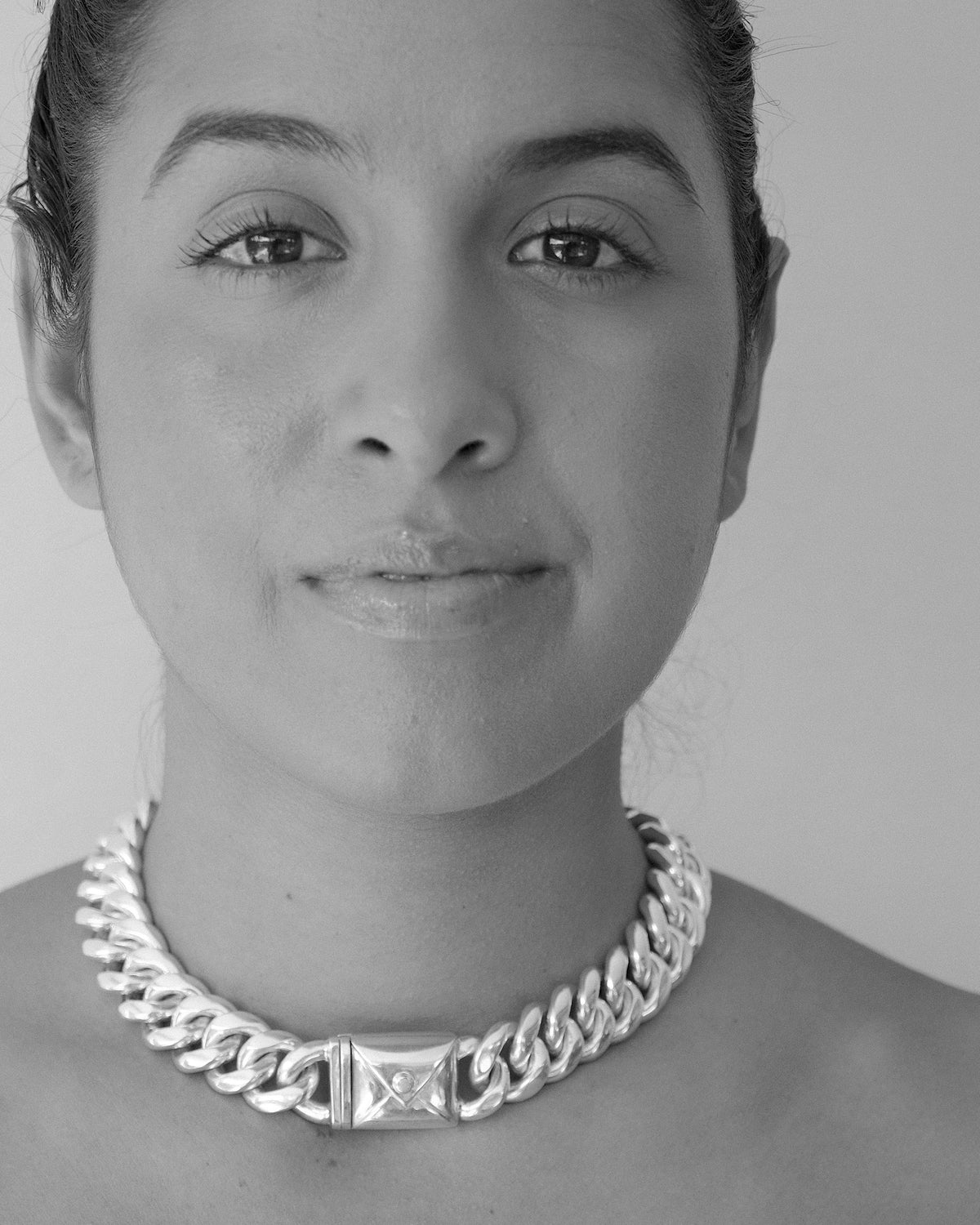 model wears a thick cuban link necklace