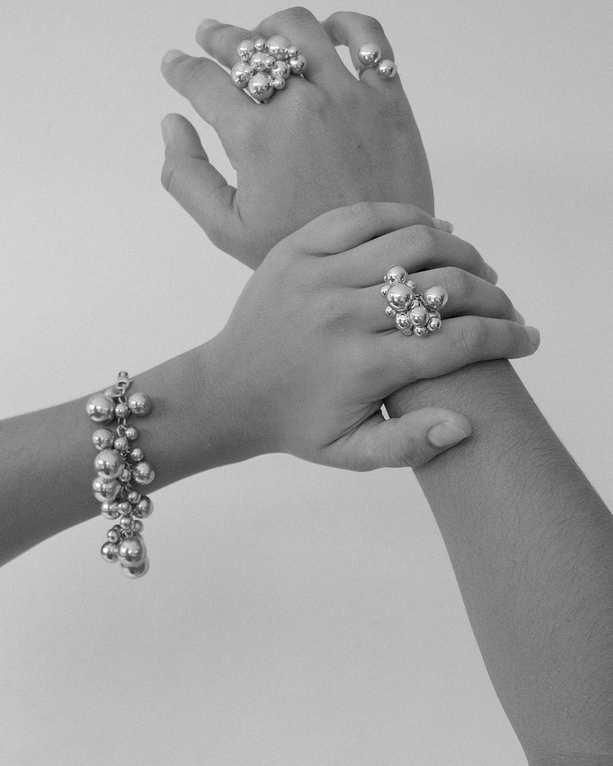 model wears a series of bubble jewellery