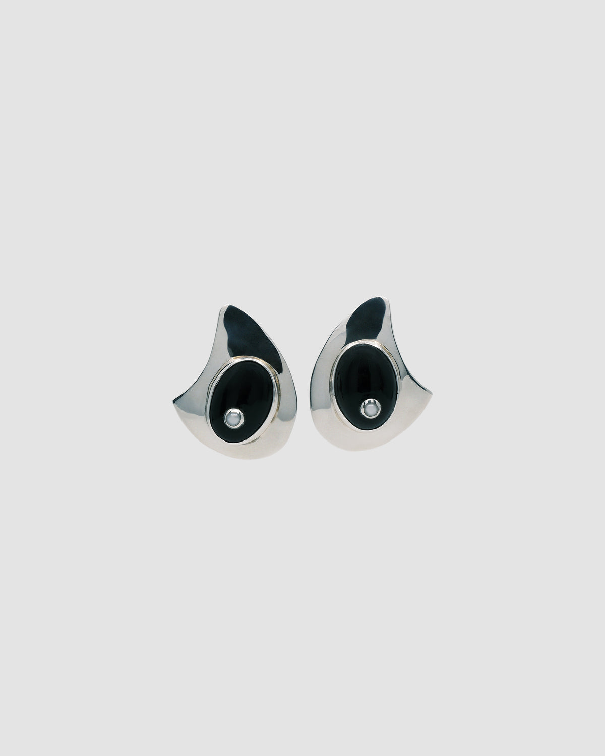 organic shaped silver earrings with a large onyx stone with a pearl centre