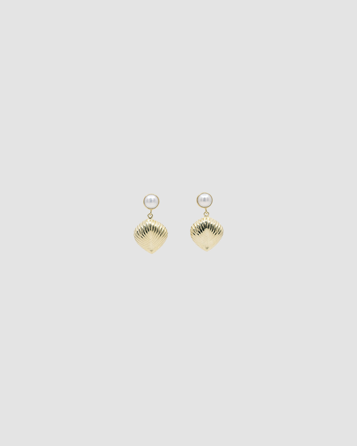 Pearl stud with gold shell like drop earring