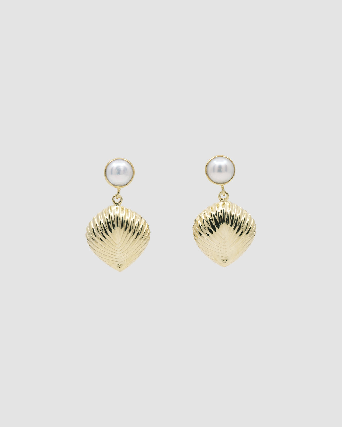 Pearl stud with gold shell like drop earring