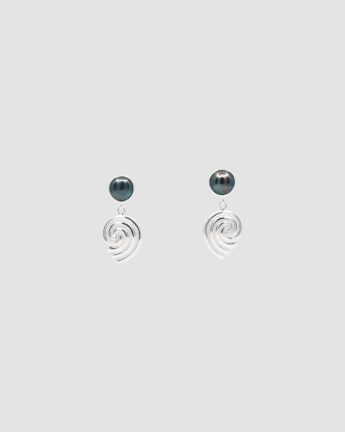 black pearl studs with a silver swirl drop earrings