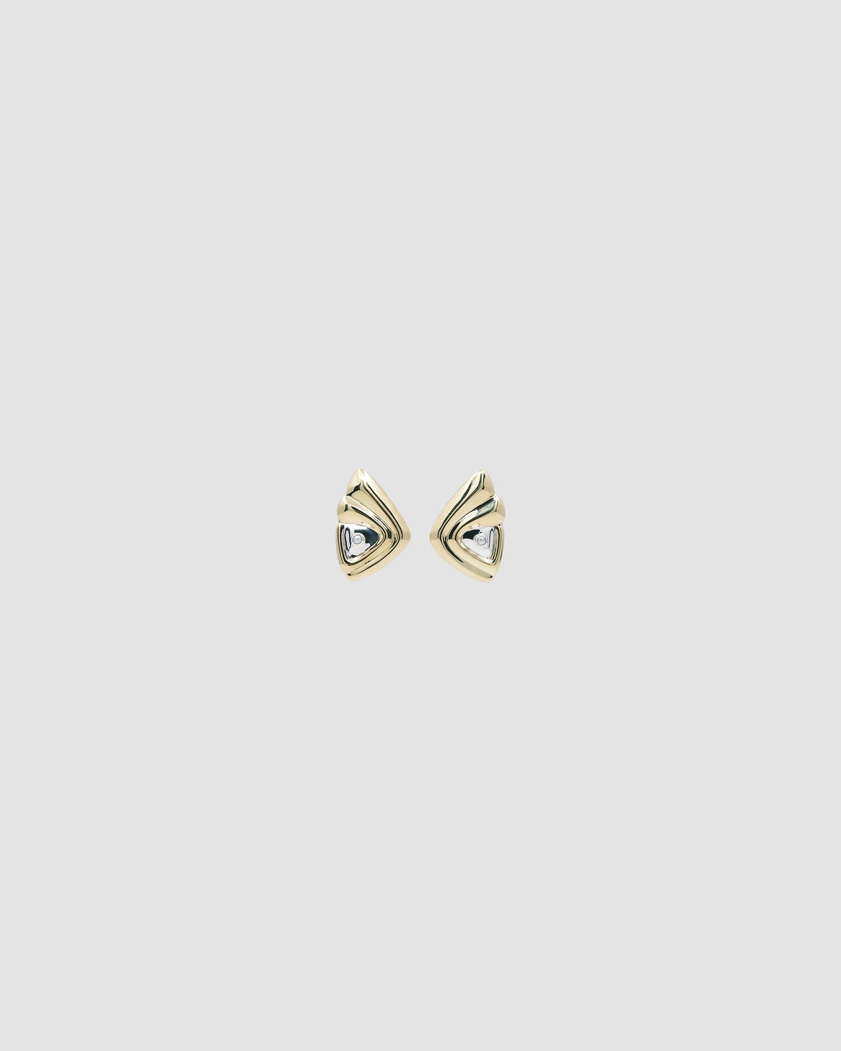 large gold and silver triangle shaped statement earrings with a single pearl stud