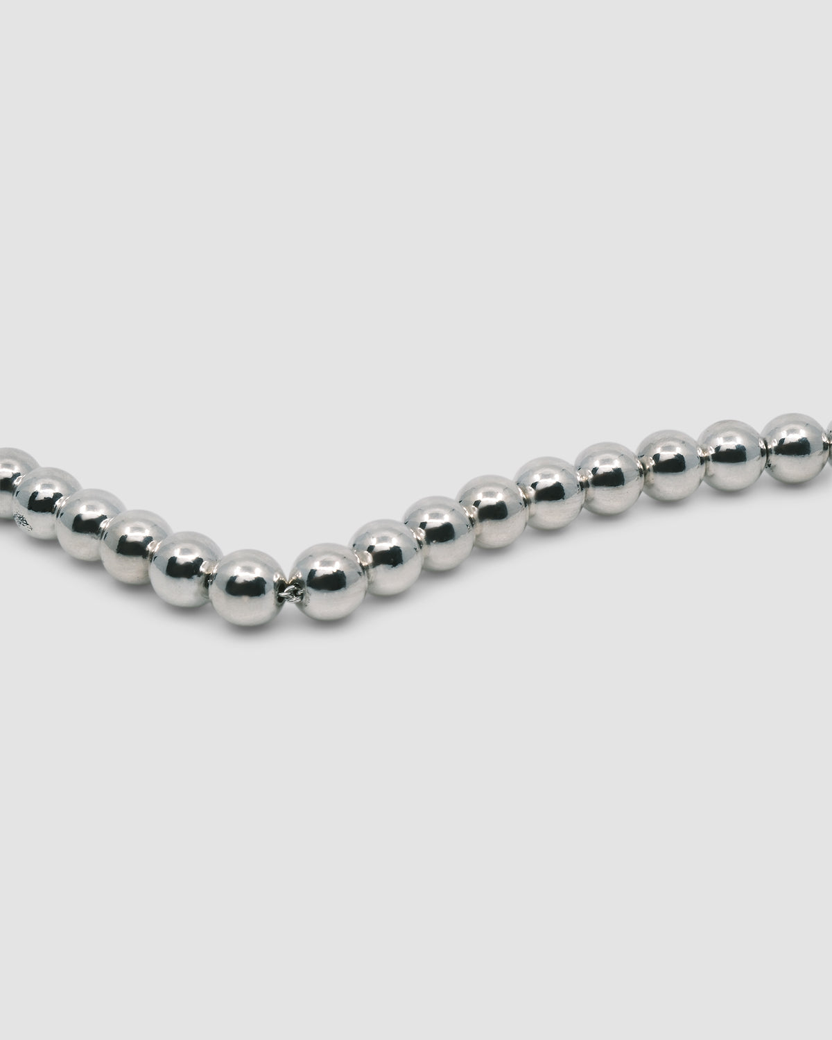 a silver ball bracelet