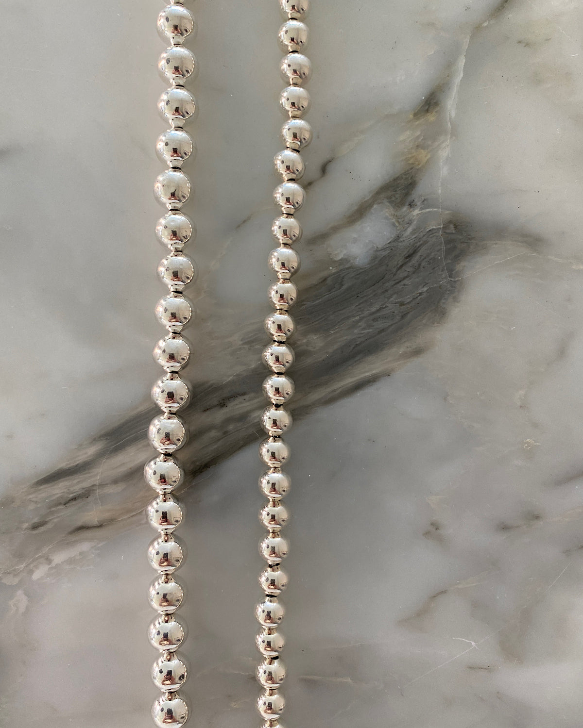 example of silver ball chain necklaces in two widths