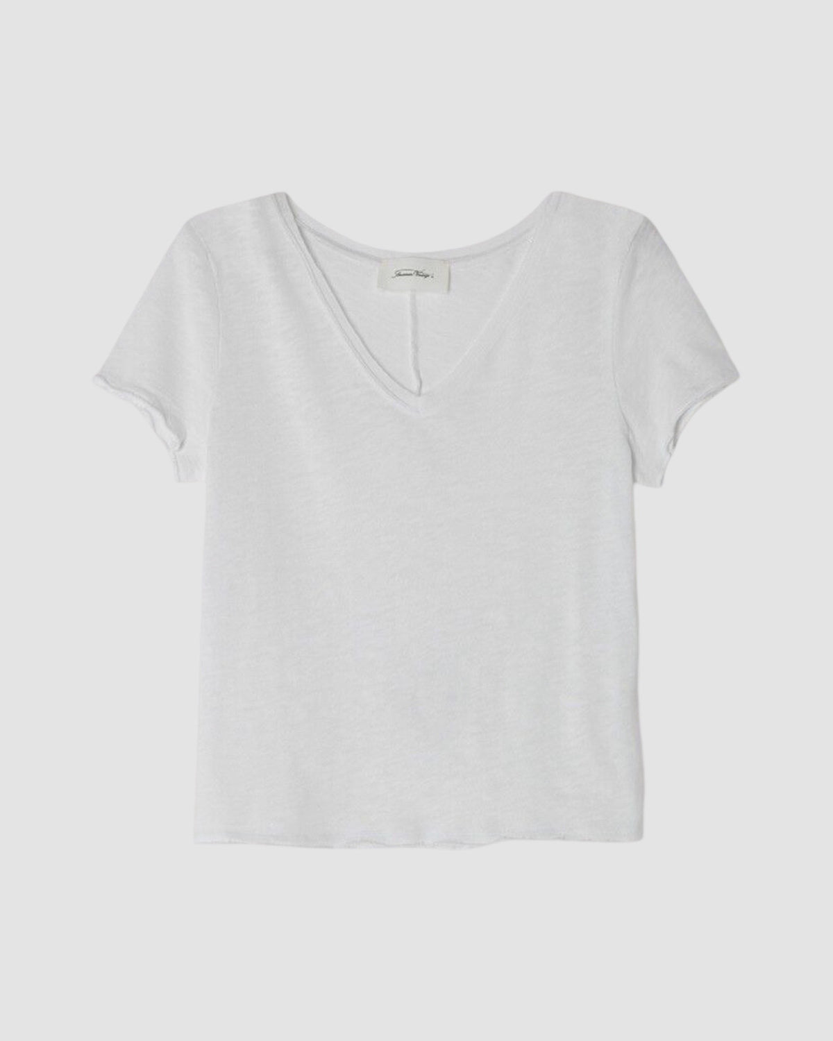 White t-shirt on a light gray background