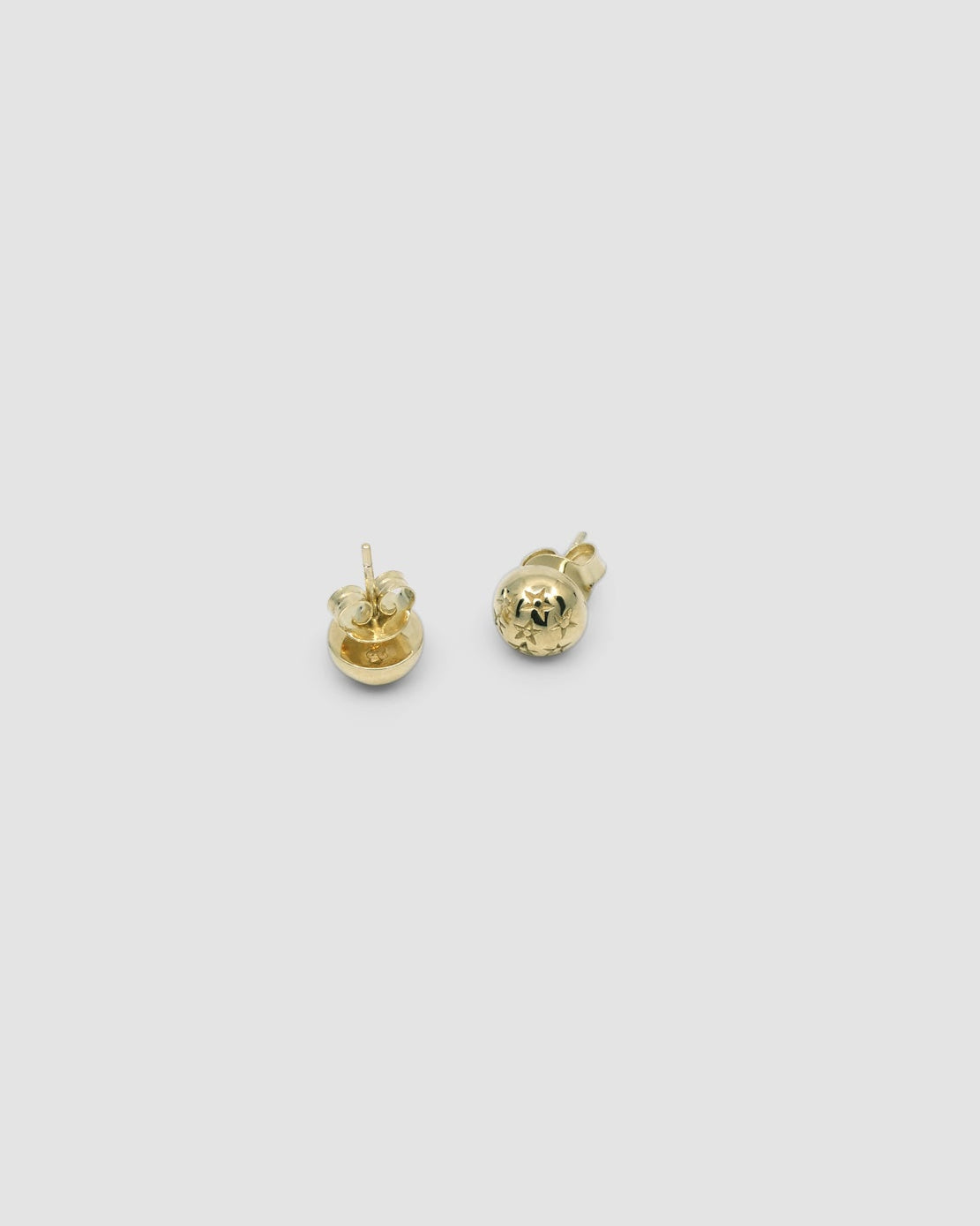 very small gold star stamped dome stud earrings