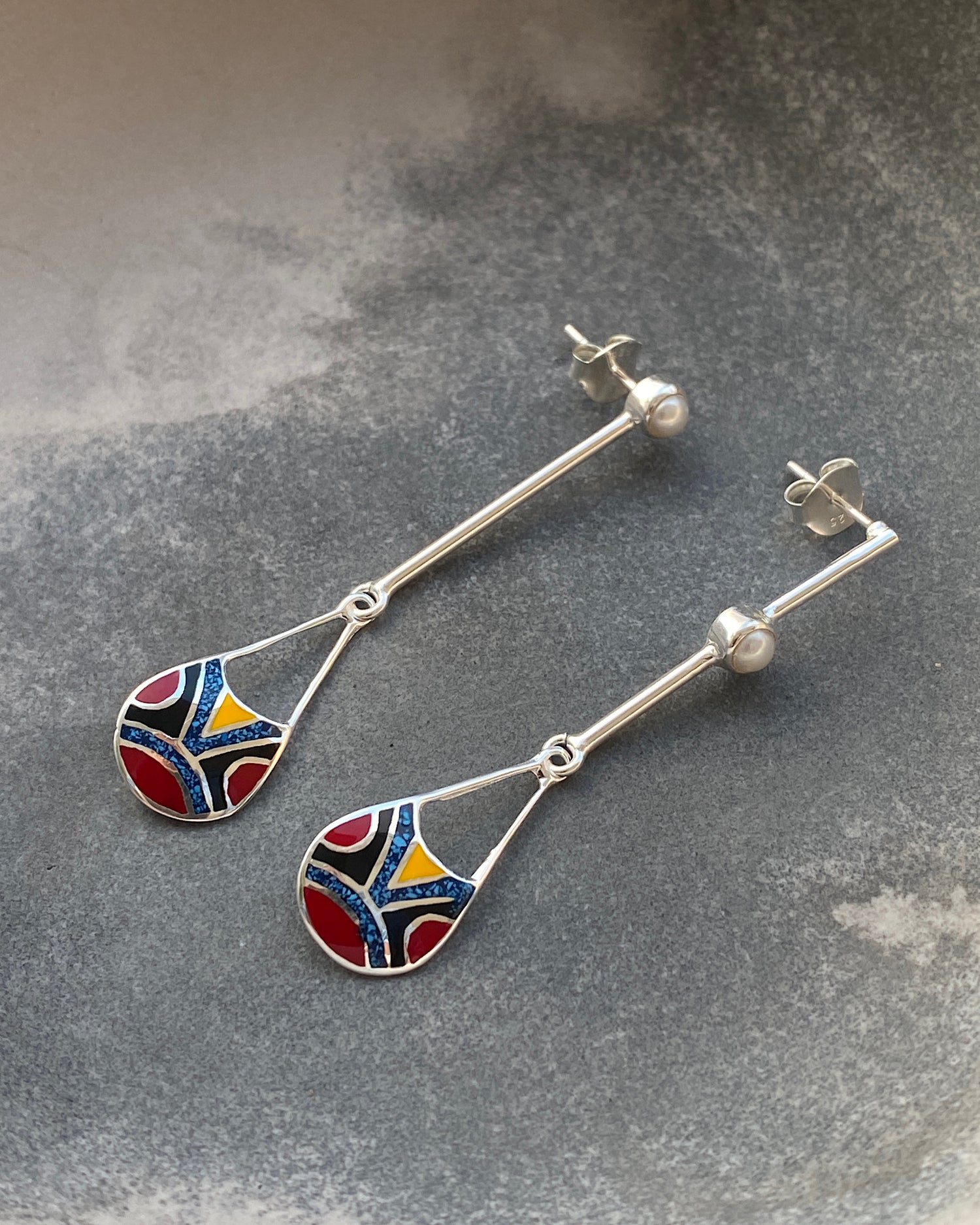 silver drop earrings with red, black & blue and shell drop charms and odd pearls on the drop 