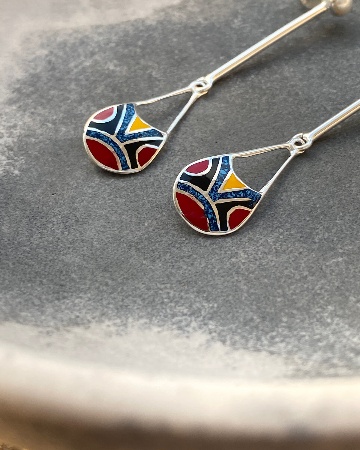 silver drop earrings with red, black & blue and shell drop charms and odd pearls on the drop 