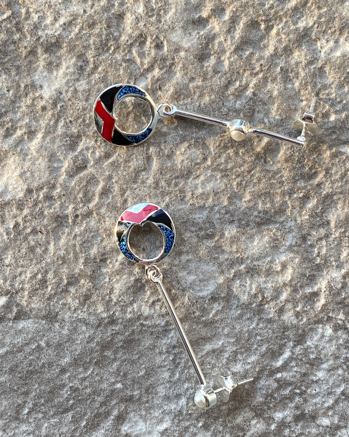 silver drop earrings with red, black & blue and shell drop charms and odd pearls on the drop 