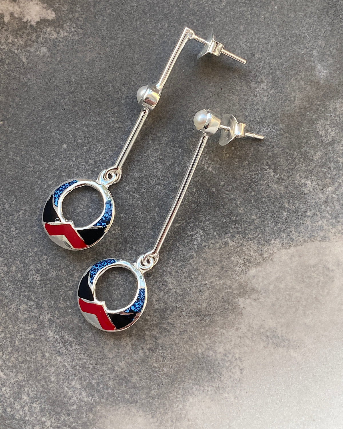 silver drop earrings with red, black & blue and shell drop charms and odd pearls on the drop 