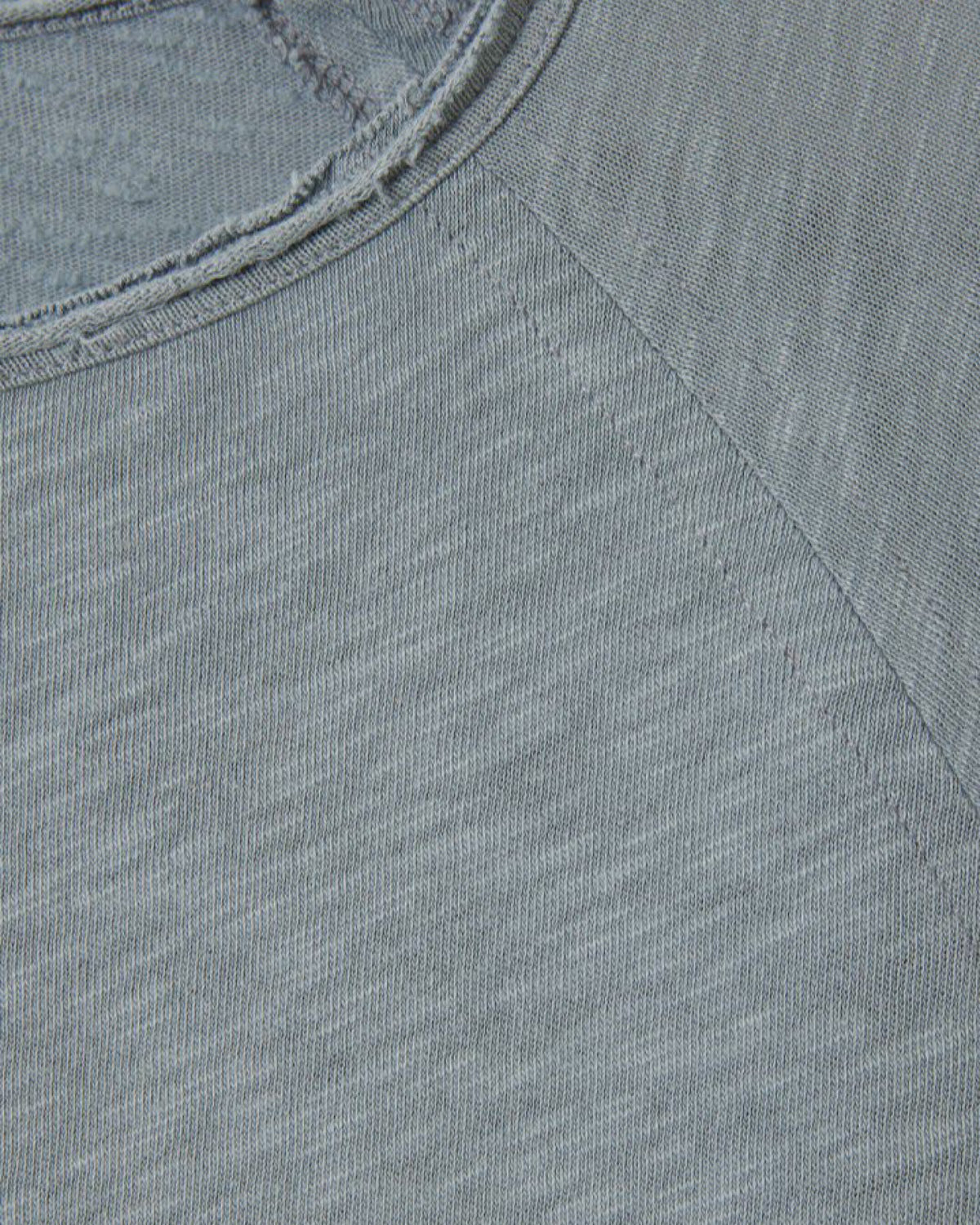 Close-up of a textured grey boat fabric with a focus on the stitching detail.
